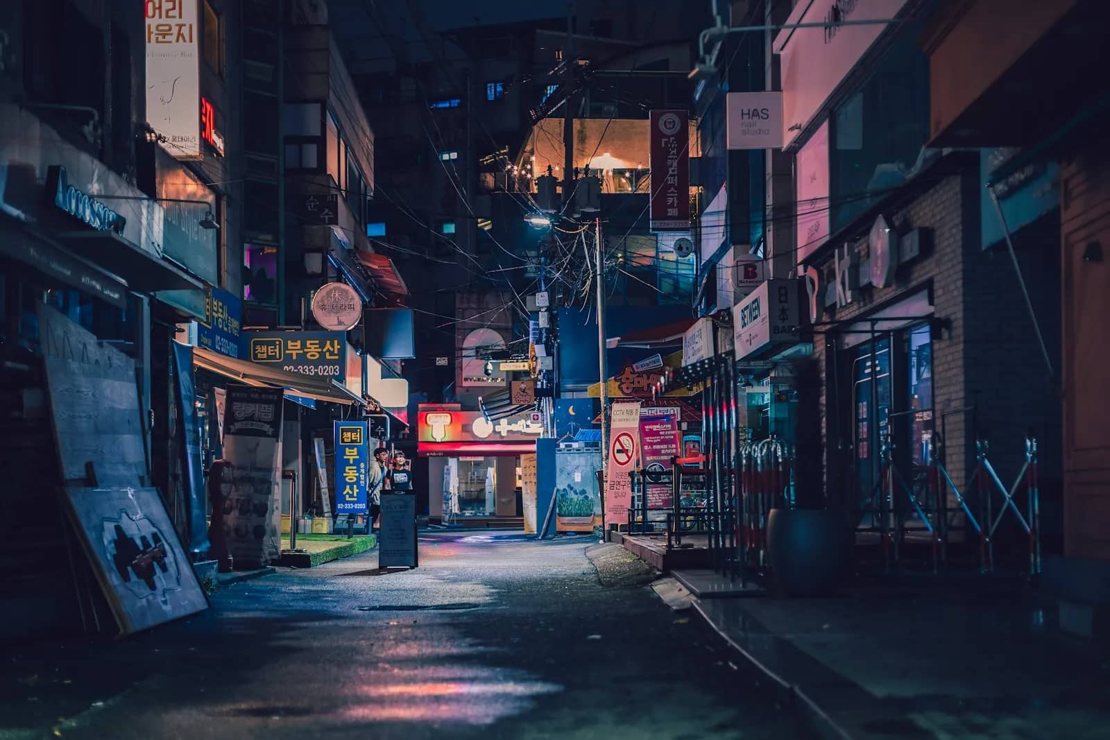 Empty back alley near Hongik University Station at night in blue light