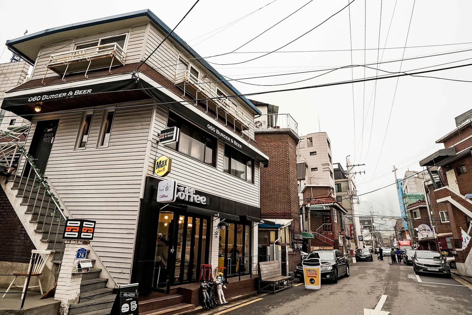 Low-rise houses and small cafes along Mangnidan-gil street in Mangwon-dong, Seoul