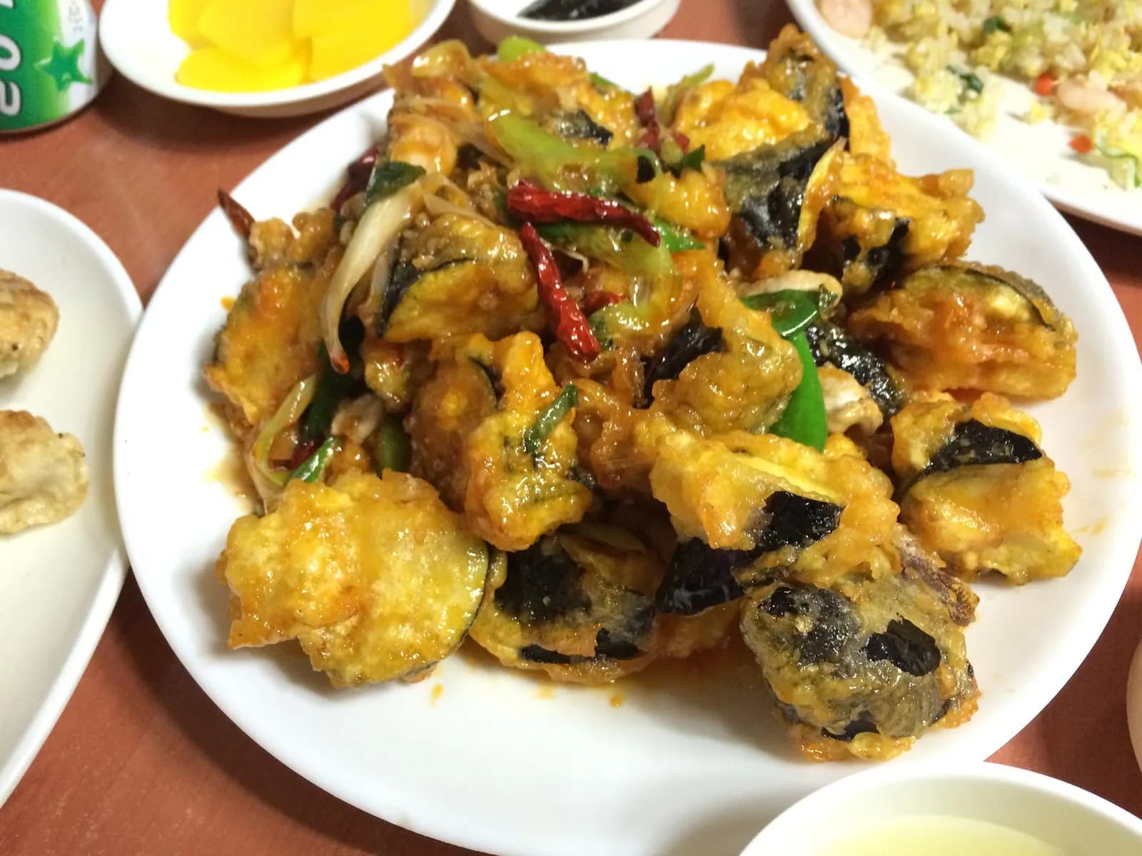 Plate of fried eggplant with chilies at a Chinese restaurant in Yeonnam-dong, with pickled radish